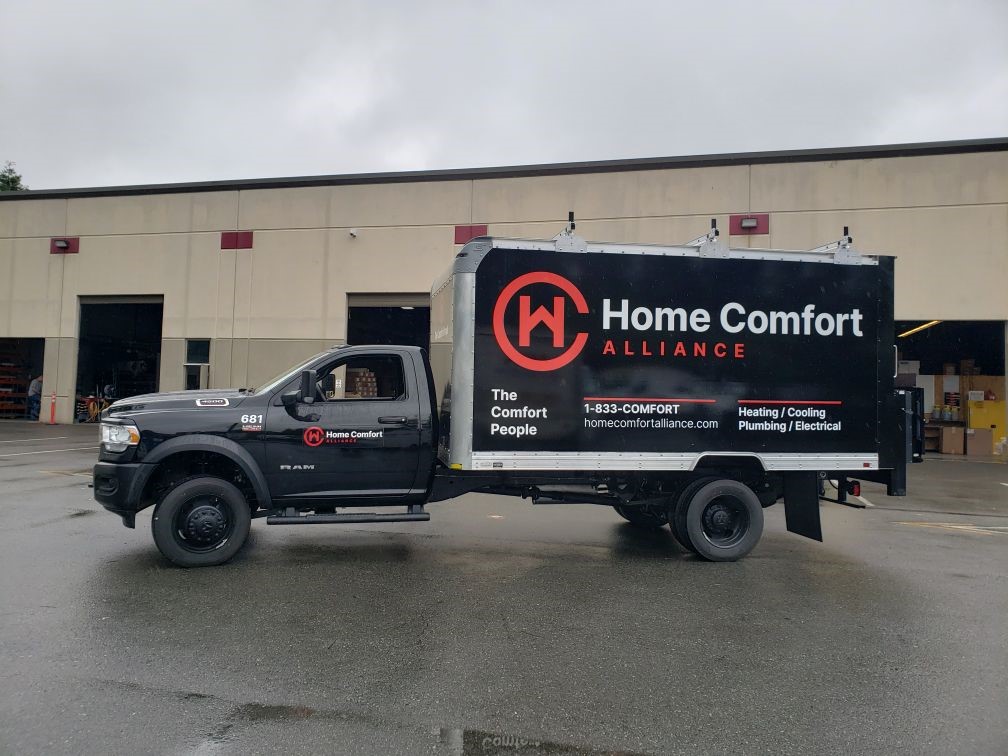 Large work truck with vehicle wrap